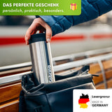 Person storing engraved stainless steel thermobecher in backpack, ideal for coffee or tea on the go, made in Germany.